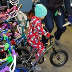 Young boy and tries out his bicycle from the Lions Club Bicycles from Heaven giveaway Saturday. DAN HAMMOCK THE DAILY WORLD