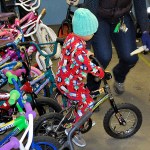 Young boy and tries out his bicycle from the Lions Club Bicycles from Heaven giveaway Saturday. DAN HAMMOCK THE DAILY WORLD