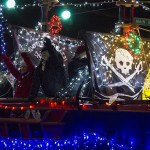 Members of the South Beach Buccaneers help celebrate the holidays during the Montesan Festival of Lights on Saturday night during the annual parade. (Photo by Corey Morris/GH Newspaper Group)