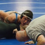 (Brendan Carl | The Daily World) Grays Harbor&rsquo;s Braiden Klimp looks at the official for the pinfall call during his exhibition match against BYU&rsquo;s Jacob Profitt on Saturday monring at GHC Gym.