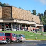 Students mill outside the front entrance of Hoquiam High School shortly after a lockdown caused by a student claiming to have a weapon around 11 a.m. Tuesday. School officials and Hoquiam Police located the 14-year old student; a search turned up no weapon. The student was arrested for malicious mischief for damaging a door as he exited the school. The lockdown was lifted before noon.