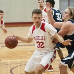(Brendan Carl | The Daily World) Hoquiam&rsquo;s Jace Varner drives around a Cascade Christian defender on Tuesday. Varner finished with 25 points against the Cougars.