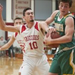 (Brendan Carl | The Daily World) Hoquiam&rsquo;s Anthony Nash reaches in to try and force a held ball against Tumwater on Friday.