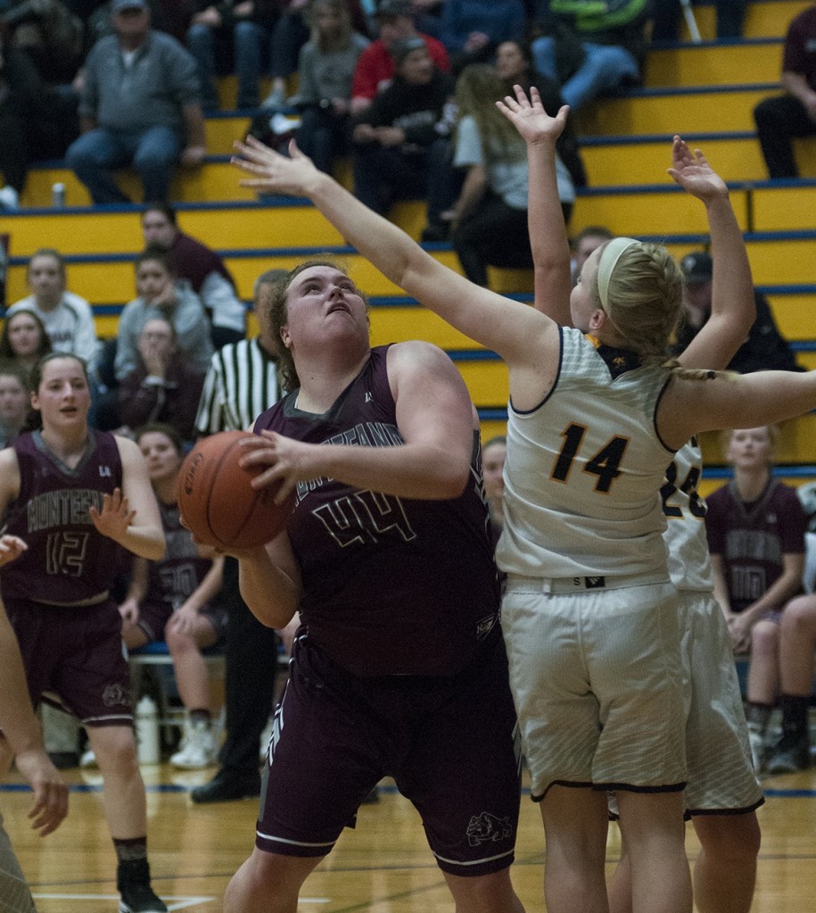 (Brendan Carl | The Daily World) Montesano&rsquo;s Jordan Spradlin works around Aberdeen&rsquo;s Mari Rabung on Tuesday.
