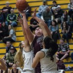 (Brendan Carl | The Daily World) Montesano&rsquo;s Jordan Spradlin goes up for a shot between two Aberdeen defenders during Tuesday&rsquo;s non-league contest at Sam Benn Gym.