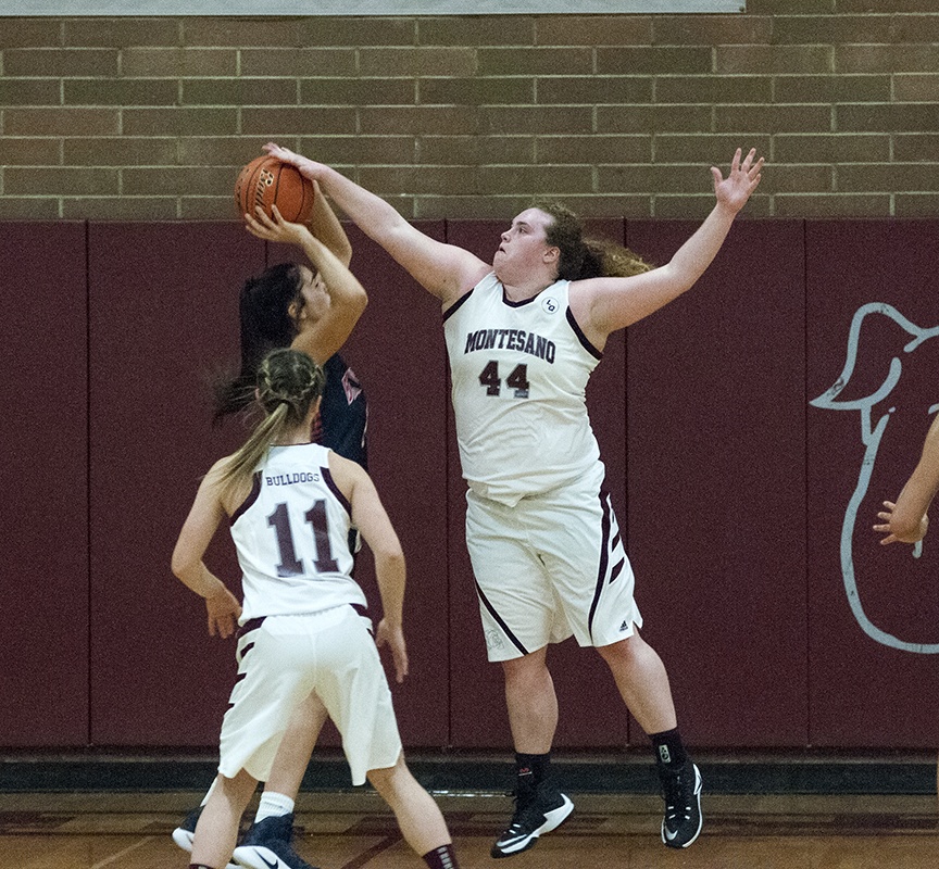 (Brendan Carl | The Daily World) Montesano&rsquo;s Jordan Spradlin blocks a shot against Black Hills on Tuesday.