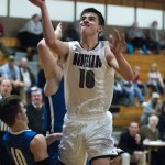 (Brendan Carl | The Daily World) Montesano&rsquo;s Trevor Ridgway rolls in two of his 19 points against Eatonville on Friday.
