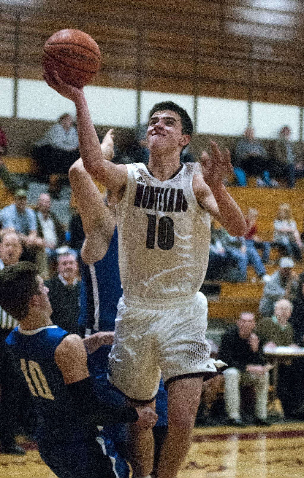 (Brendan Carl | The Daily World) Montesano&rsquo;s Trevor Ridgway rolls in two of his 19 points against Eatonville on Friday.