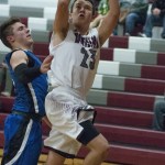 (Brendan Carl | The Daily World) Montesano&rsquo;s Noah Quinn twists to take a shot against Eatonville on Friday.