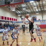 (Brendan Carl | The Daily World) Ocosta&rsquo;s Paul Bjornsgard soars in for the game-winning lay up against Willapa Valley in a Pacific 2B League game at Tenoski Gym on Monday.