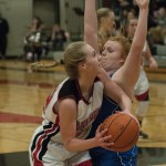 (Brendan Carl | The Daily World) Raymond&rsquo;s Winter Newman tries to drive around Willapa Valley&rsquo;s Amber Anderson on Thursday.