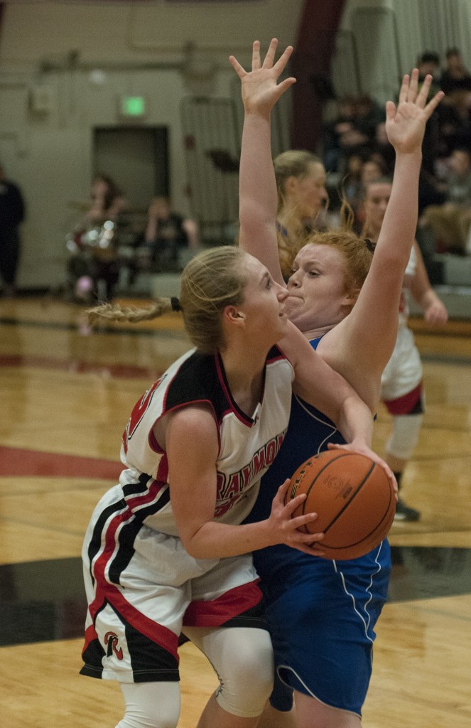 (Brendan Carl | The Daily World) Raymond&rsquo;s Winter Newman tries to drive around Willapa Valley&rsquo;s Amber Anderson on Thursday.