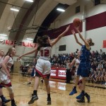 (Brendan Carl | The Daily World) Willapa Valley&rsquo;s Hannah Cook puts up a shot over the outstretched arm of Raymond&rsquo;s Mikayla Collins on Thursday.