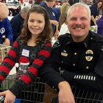 Hoquiam Police Chief Jeff Myers was among the area officers who participated in Saturday&rsquo;s Shop with a Cop event. The project, in its 18th year, teams local law enforcement with kids selected by school principals from across the Harbor for breakfast at the Aberdeen Eagles, a ride in a department vehicle and $100 to spend at Walmart. Here Myers and his partner for the event, Shaylee Johnson, smile over a cart full of toys.