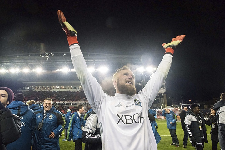 Charis Wilson | Sounders FC Seattle Sounders FC Goalkeeper Stefan Frei motions to the crowd cheering his name following his stellar MLS Cup game and MVP award. Seattle celebrates its first MLS Cup with a 0-0 (5-4) win over Toronto FC on Saturday.