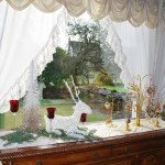 A seasonal display is framed by a window inside the Aberdeen Mansion. Morning light adds more shine to these tasteful holiday objects. (Terri Harber|The Daily World)