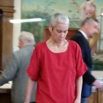 Shana Soliz walks back to her seat in the courtroom after appearing in front of Judge F. Mark McCauley on Friday in Grays Harbor County Superior Court. Soliz is the suspect in a fatal stabbing of Paul Mottinger on Nov. 21. Prosecuting and defense attorneys can be seen in the background. (Terri Harber|The Daily World)