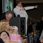 An annual highlight of the Black and White Gala United Way fundraiser is the auctioning of a puppy. This year&rsquo;s scene stealer was Chloe, a purebred American bulldog. The nine-week old pup was auctioned for more than $1,000 and came a selection of food, toys and more. Leaning down for a scratch is auctioneer Eric Nelson; pointing toward a bidder is fellow auctioneer Gary Morean.