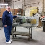 Bill Newman stands next to one of the larger castings created at the Bergstrom Foundry in Aberdeen. He retired last week. (Terri Harber|The Daily World)