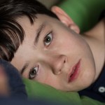Lewis MacDougall portraiys Connor in &ldquo;A Monster Calls.&rdquo; (Quim Vives/Focus Features)
