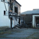 Estimated damage to the apartment building and the two adjacent garages is said to by close to $50,000. (BOB KIRKPATRICK|THE DAILY WORLD)