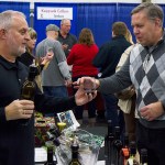 (Jusrtin Damasiewicz | The Vidette) Steve Padula with Bateaux Cellars of Toledo serves a glass of wine to Auburn&rsquo;s Larry Churchwell during last year&rsquo;s Elma Winter Wine Festival at the Grays Harbor County Fairgrounds.