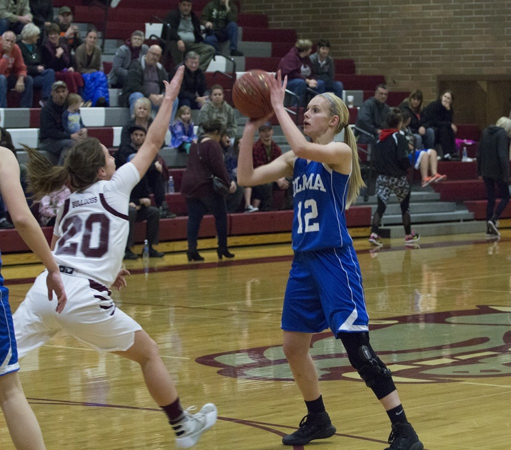 (Justin Damasiewicz | GH Newspaper Group) Elma&rsquo;s Brooke Sutherby shoots over the outstretched arm of Montesano&rsquo;s Josie Toyra.