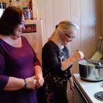 Linda Cazier watches Becky Davenport stir a pot of Menudo Friday afternoon at Esther House. Cazier is a pastor at the church and is Jennifer Chuks Nwokike&rsquo;s mother. Davenport teaches Bible school, also at the church. Both women devote time to the shelter. (Terri Harber|The Daily World)