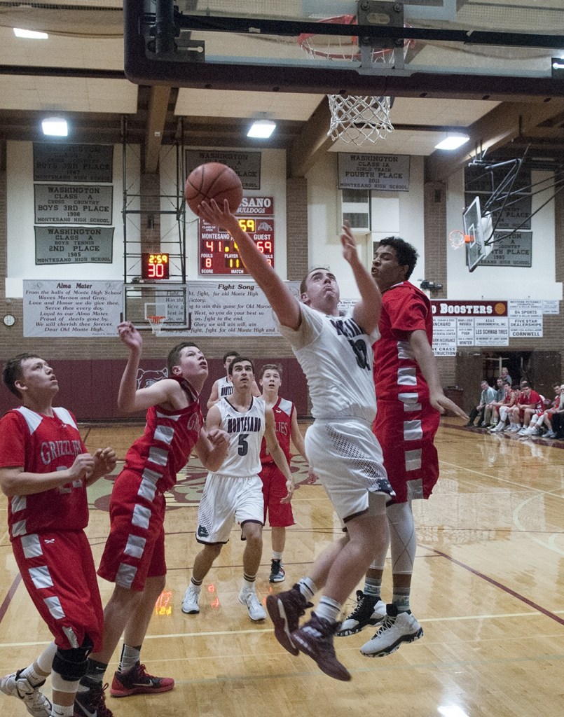 (Brendan Carl | The Daily World) Montesano&rsquo;s LJ Valley floats in for a layup against Hoquiam on Thursday.