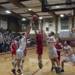 (Brendan Carl | The Daily World) Hoquiam&rsquo;s Jack Adams III goes up for a rebound between Montesano&rsquo;s Seth Dierkop (41) and LJ Valley (32) during an Evergreen 1A League game at Bo Griffith Gym on Thursday.