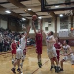 (Brendan Carl | The Daily World) Hoquiam&rsquo;s Jack Adams III goes up for a rebound between Montesano&rsquo;s Seth Dierkop (41) and LJ Valley (32) during an Evergreen 1A League game at Bo Griffith Gym on Thursday.