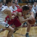 (Brendan Carl | The Daily World) Hoquiam&rsquo;s Ryan Espedal and Montesano&rsquo;s Seth Dierkop battle for a loose ball during an Evergreen 1A League game at Bo Griffith Gym on Thursday.