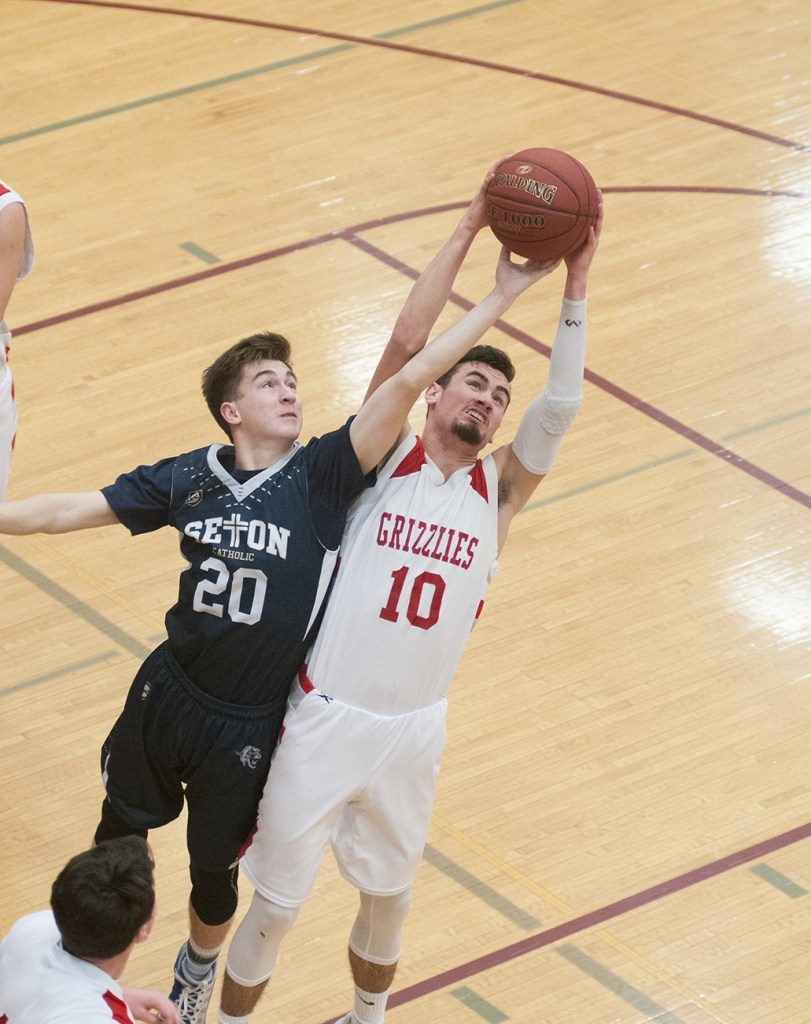 (Brendan Carl | The Daily World) Hoquiam&rsquo;s Anthony Nash stretches for a rebound against Seton Catholic on Thursday.