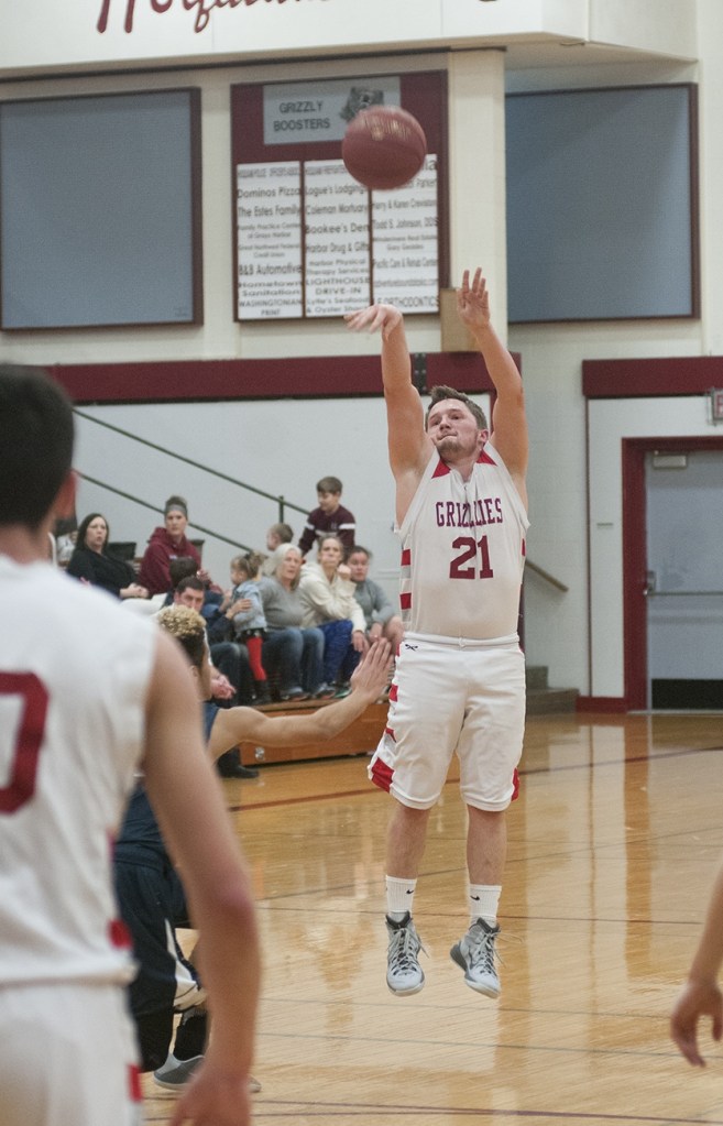 (Brendan Carl | The Daily World) Hoquiam&rsquo;s Jerod Steen puts up a 3-pointer against Seton Catholic on Thursday. Steen hit seven treys on the night.