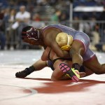 (Sue Michalak) Hoquiam&rsquo;s Artimus Johnson pins Naches Valley&rsquo;s Hunter Gangle on Friday. Johnson spent less than two minutes total wrestling in his two matches on his way to the semifinals today.