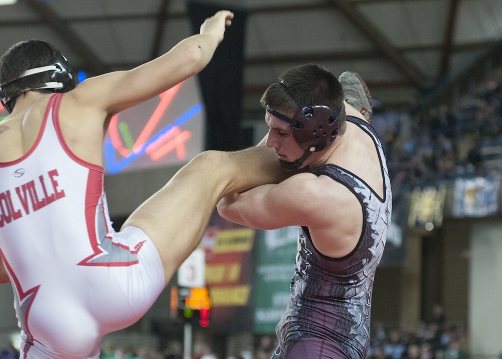 (Brendan Carl | The Daily World) Montesano&rsquo;s Austin Cain works to control the leg of Colville&rsquo;s Thailer Morrison during the final on Saturday.