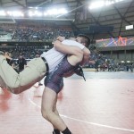 (Brendan Carl | The Daily World) Montesano&rsquo;s Austin Cain lifts his father, Darold, off the ground as the two celebrate Cain winning the 1A state title for 160-pounds on Saturday.