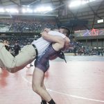 (Brendan Carl | The Daily World) Montesano&rsquo;s Austin Cain lifts his father, Darold, off the ground as the two celebrate Cain winning the 1A state title for 160-pounds on Saturday.