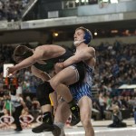 (Brendan Carl | The Daily World) Elma&rsquo;s Justin Sample works to throw Dalton Young of Lakeside Nine Mile Falls on Saturday.