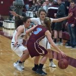(Brendan Carl | The Daily World) Montesano&rsquo;s Hannah Quinn, left, and Josie Toyra trap Stevenson&rsquo;s Kaitlyn Rathgeber during a District IV 1A tournament game at Bo Griffith Gym on Friday. Monte defeated Stevenson 69-26.