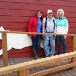Kristina Snyder, administrative director; Pat Pierce, kennels manager; and, Molle Bouch, board president, stand outside the PAWS building on First Street in Aberdeen. The ADA ramp is among improvements to the group&rsquo;s headquarters. (Terri Harber|The Daily World)