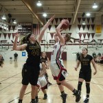 (Brendan Carl | The Daily World) Raymond&rsquo;s Winter Newman goes up for a shot as Ilwaco&rsquo;s Madelin Jacobson tries to get a block during a regional 2B girls contest at Chehalis on Saturday. The Fisherman defeated the Seagulls 57-36.