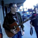 Wil Russoul, local music promoter and singer/songwriter, is flanked by Branden DePriest (left) and Michael B. Johnson as the trio move from the Wine Sellars to the Tap Room between gigs. This was part of one of The Alley&rsquo;s &ldquo;First Friday&rdquo; events, where local musicians move from venue to venue offering music seekers a wide variety of musical choices everywhere from bars to tattoo and ice cream shops. DePriest is a founding member of the Montesano punk/metal band Gebular. Johnson has played with the &ldquo;heavy groove&rdquo; rock band Reverent Circle.