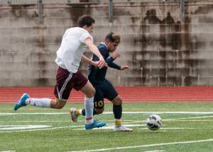 (Brendan Carl | The Daily World) Aberdeen&rsquo;s Miguel Torres tries to race past Montesano&rsquo;s Riccardo Marangon during a non-league soccer match at Jack Rottle Field on Saturday. Torres finished with a hat trick against the Bulldogs in a 4-0 Aberdeen victory.