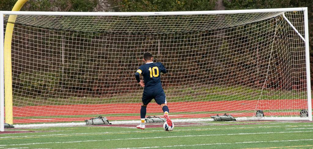 (Brendan Carl | The Daily World) Aberdeen&rsquo;s Miguel Torres shoots the ball into a wide open net after beating the Montesano goalkeeper to complete his hat trick on Saturday.