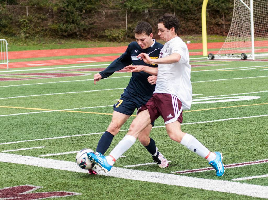 (Brendan Carl | The Daily World) Aberdeen&rsquo;s Dylan Hughes and Montesano&rsquo;s Riccardo Marangon battle for the ball during a non-league soccer match at Jack Rottle Field on Saturday.