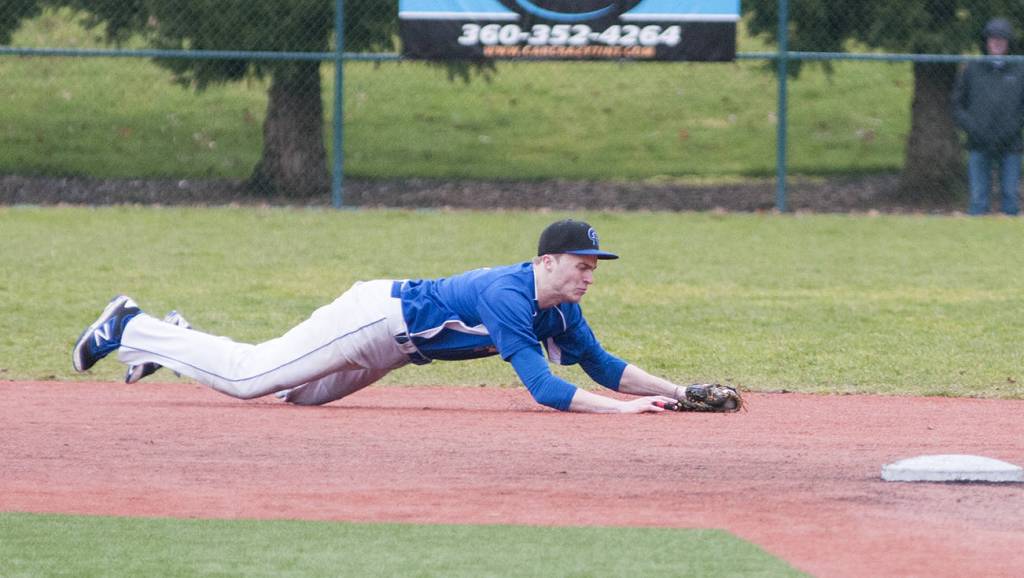 (Brendan Carl | The Daily World) Grays Harbor College&rsquo;s Zach Withrow dives to grab a line drive against Big Bend on Saturday.