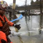 Crews from the Dept. of Ecology assess the source of an oil leak emanating from the former research vessel Hero, which partially sunk on Willapa Bay in the Bay Center area Saturday.