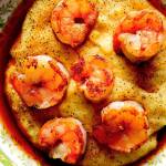 Top pan-seared shrimp with a slightly sweet sherry vinegar-shallot sauce before serving them with Parmesan polenta. (Photo by Lake Fong/Pittsburgh Post-Gazette)