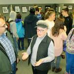 North Beach High School art teacher Richard Villar and Associated Arts of Ocean Shores event organizer Kathy Harris enjoying the results of their efforts, and those of 47 young artists at the inaugural Youth Fine Art Open Show artists reception at the Ocean Shores Public Library. (SCOTT D. JOHNSTON PHOTO)
